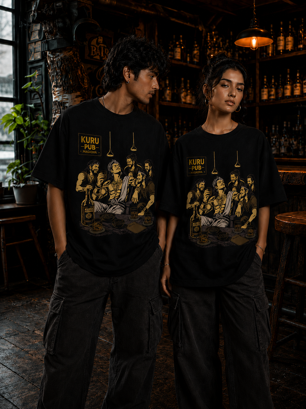Male and female models wearing Kuru Pub oversized t-shirt in black featuring Magadha & Kurukshetra warrior artwork – Mild Popie