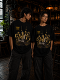 Male and female models wearing Kuru Pub oversized t-shirt in black featuring Magadha & Kurukshetra warrior artwork – Mild Popie