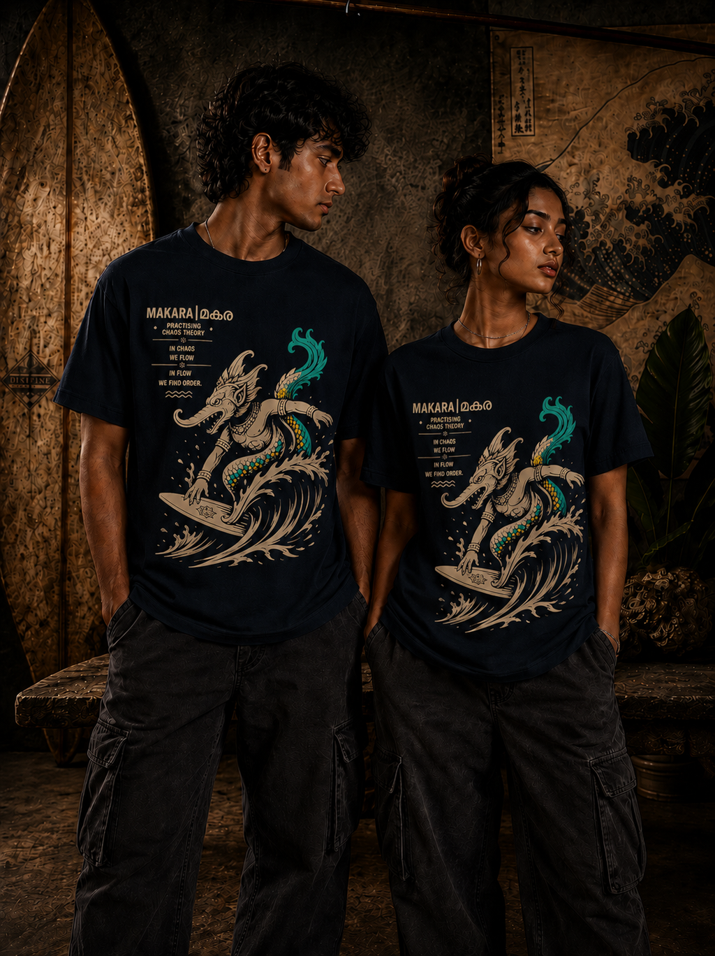 Male and female models wearing Surfing Makara regular fit t-shirt in black with surfing mythological artwork – Mild Popie
